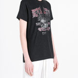 Black t-shirt worn by a person, showing the t-shirt fit