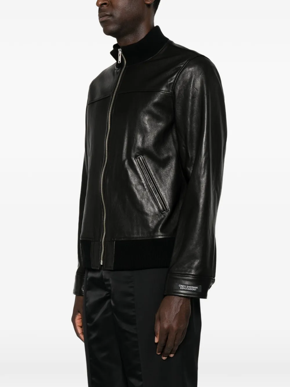 Black jacket worn by a person, showing the jacket fit