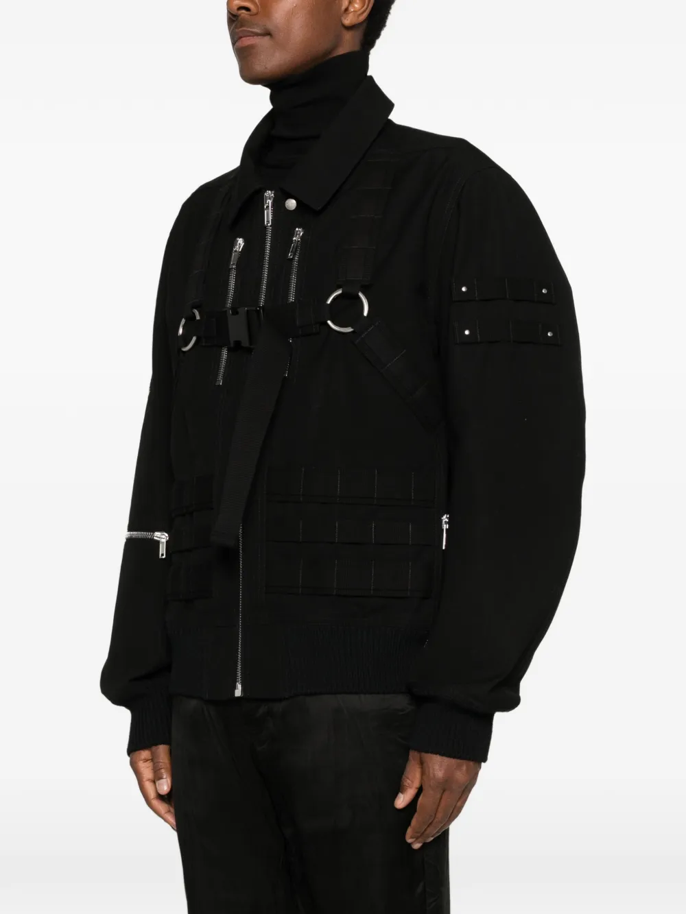 Black jacket worn by a person, showing the jacket's fit