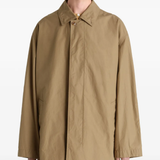 Close up of tan jacket, showing texture of the cotton fabric