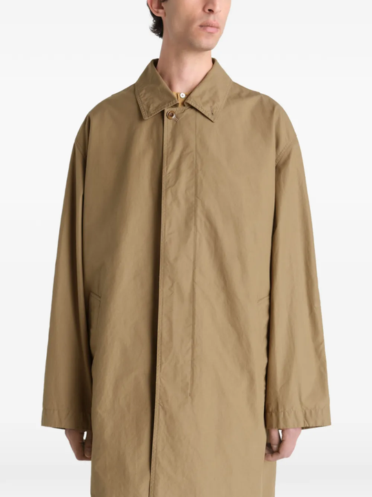 Close up of tan jacket, showing texture of the cotton fabric