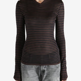 Brown top worn by a person, showing the top's fit