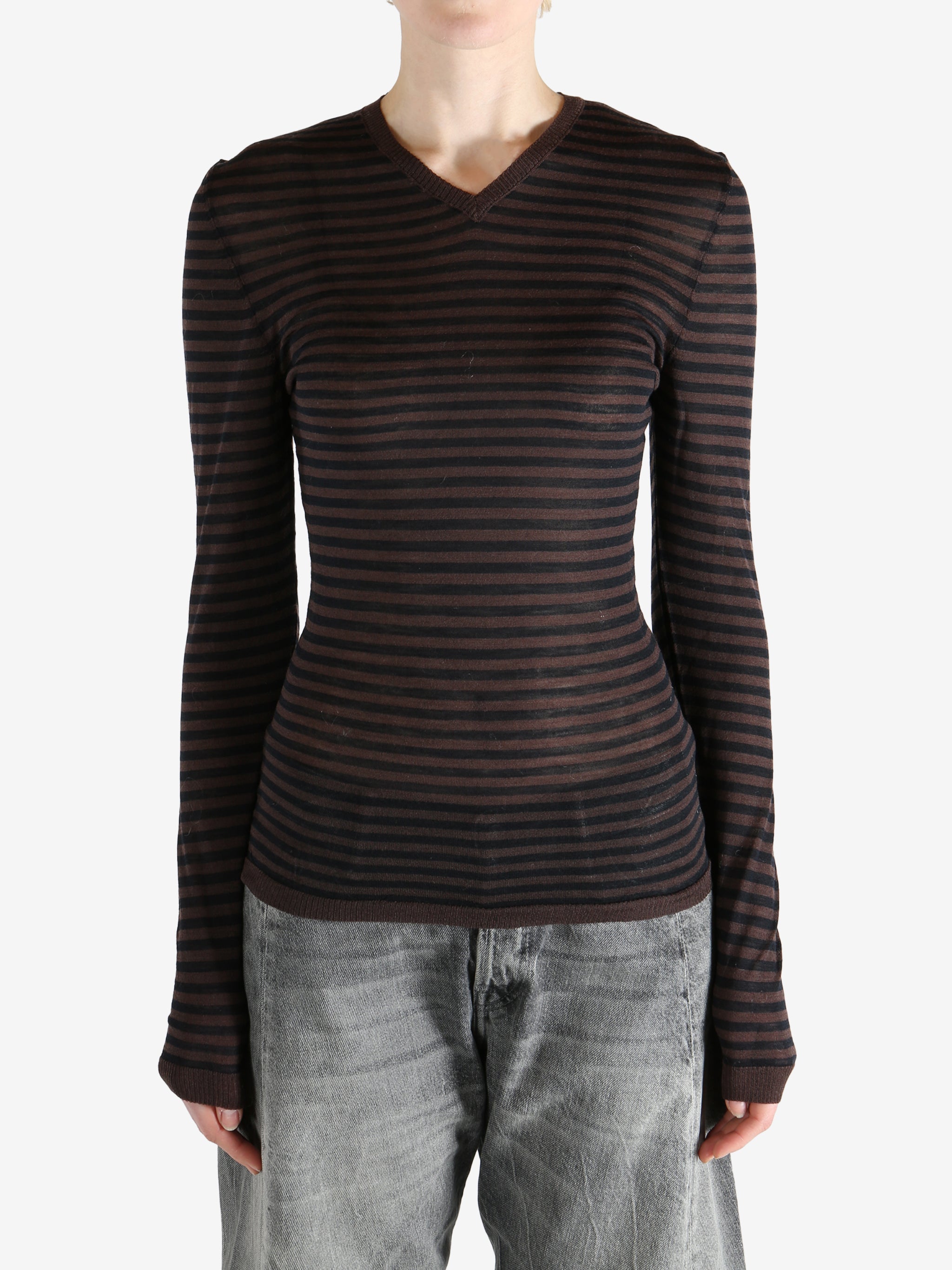 Brown top worn by a person, showing the top's fit