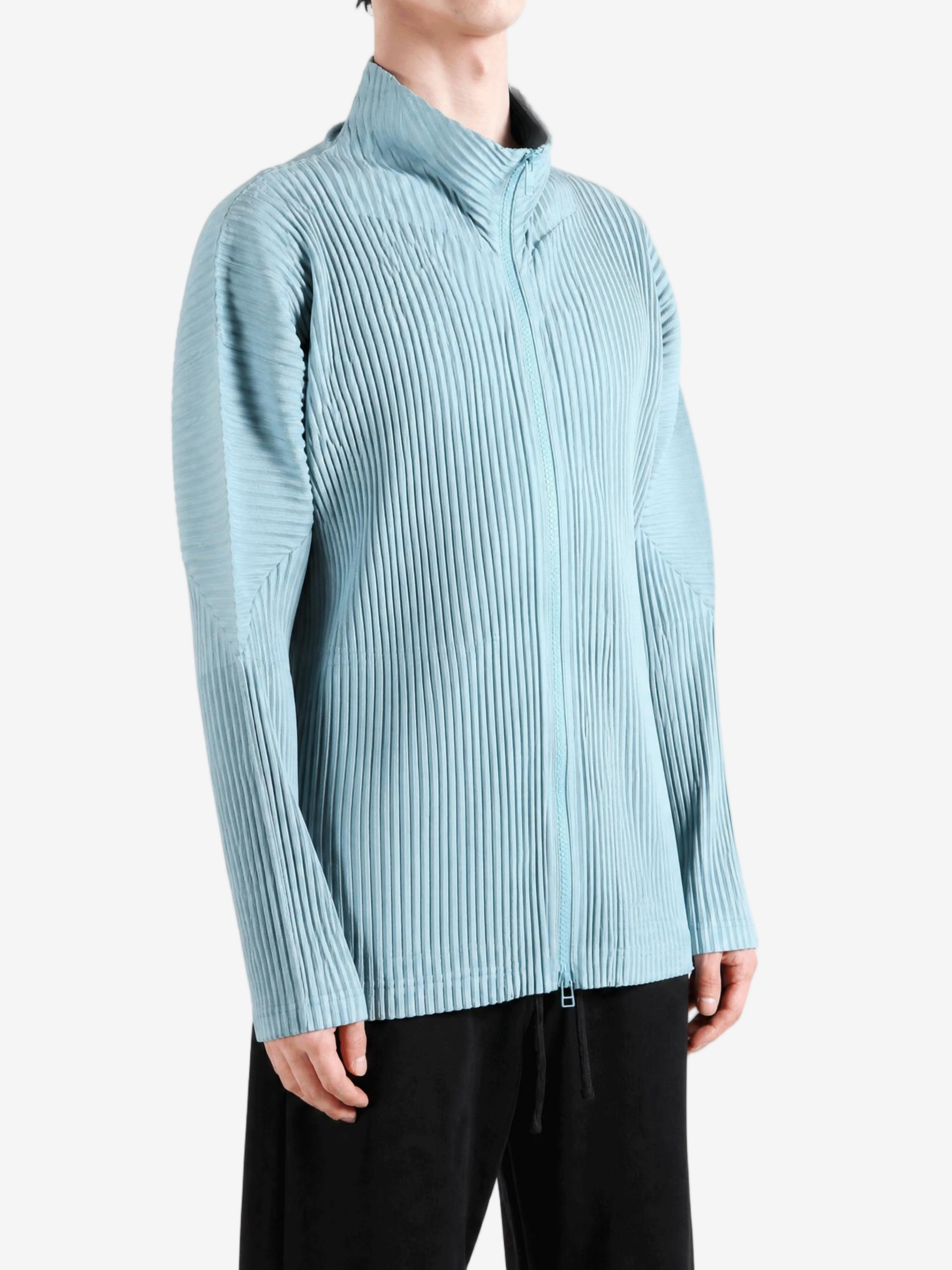 Blue jacket worn by a person, showing the jacket fit