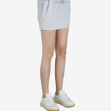 Grey skirt worn by a person, showing the skirt's fit