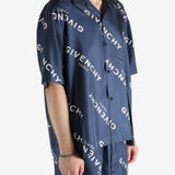 Navy shirt worn by a person, showing the shirt's fit