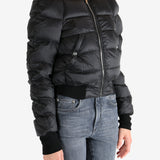 Black jacket worn by a person, showing the jacket fit