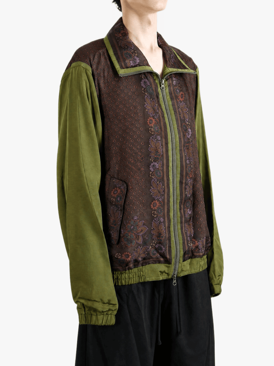 Green jacket worn by a person, showing the jacket fit