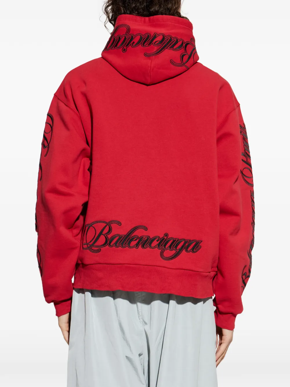 Red sweats-hoodies worn by a person, showing the cotton fit