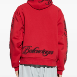 Red sweats-hoodies worn by a person, showing the cotton fit