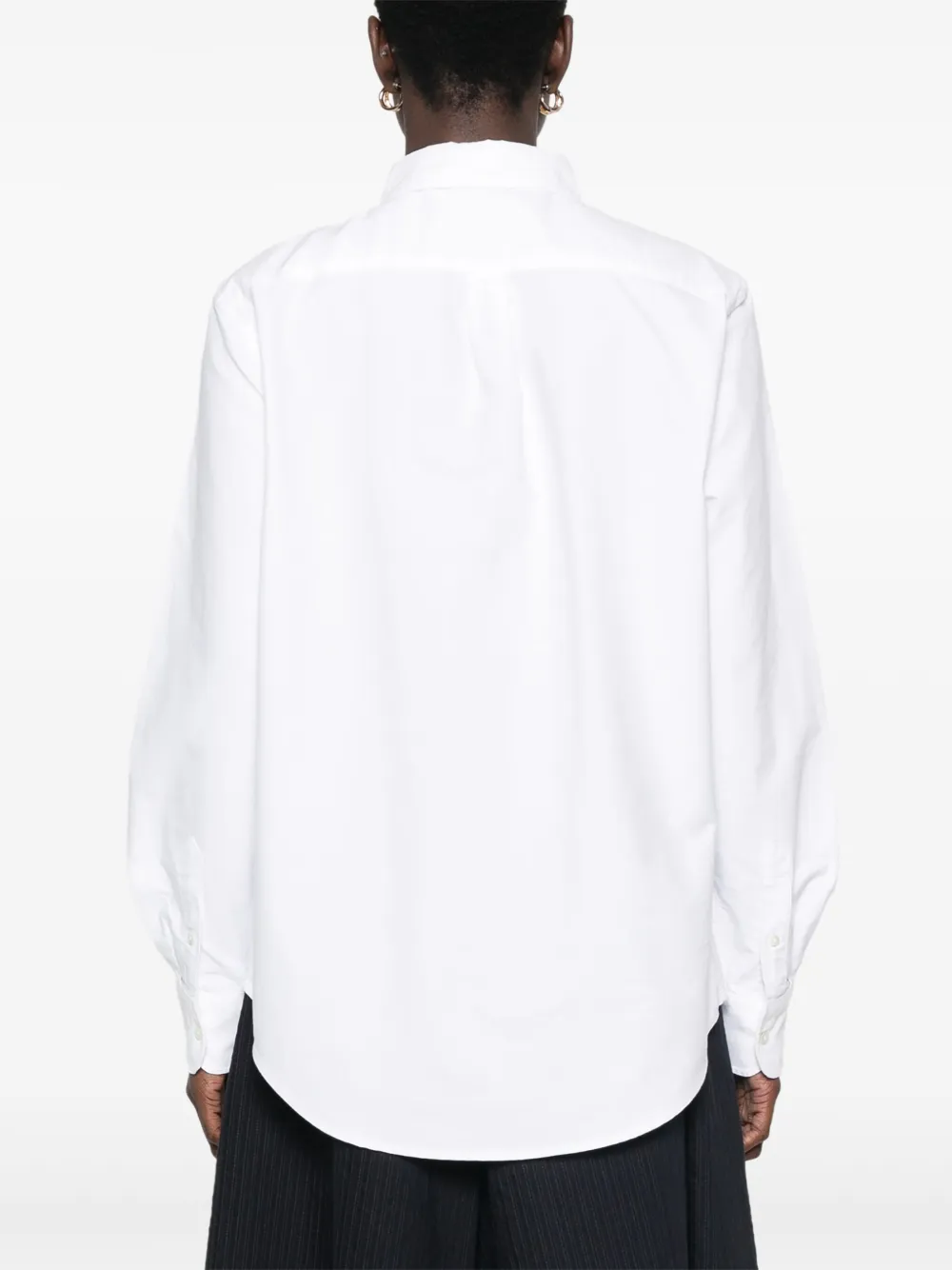 White shirt,worn by a person, showing the shirt's fit