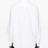 White shirt,worn by a person, showing the shirt's fit