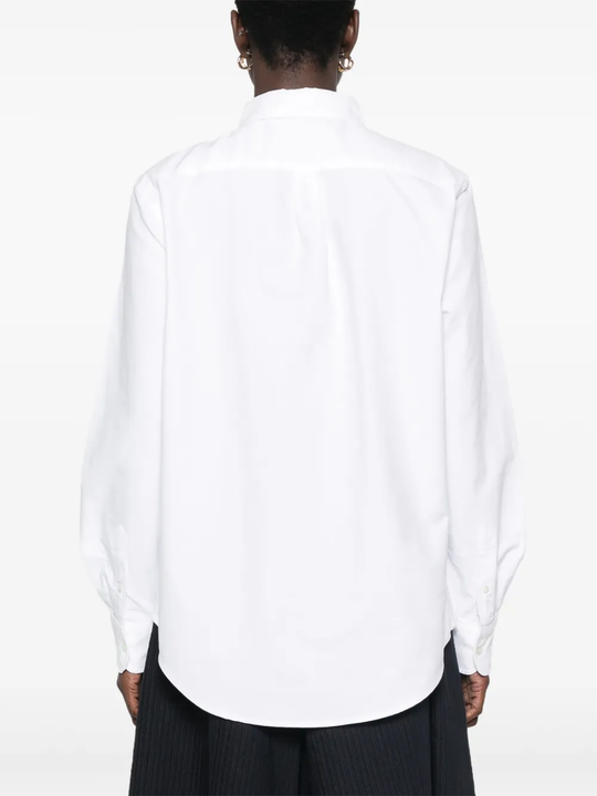 White shirt,worn by a person, showing the shirt's fit