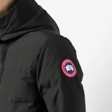 close up of black jackets-coats, showing texture of the polyester and cotton fabric