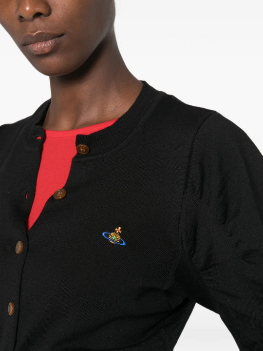 Black top worn by a person, showing the top fit