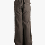 Brown pant worn by a person, showing the cotton fit