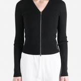 Black top worn by a person, showing the top fit