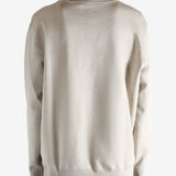 Tan shirts worn by a person, showing the shirts fit