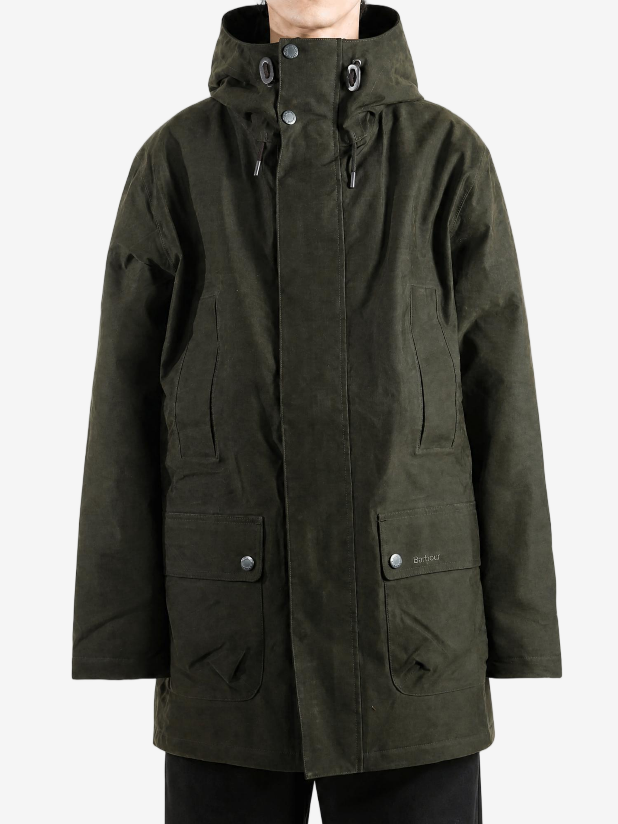 Green jacket worn by a person, showing the jacket fit