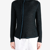 Black top worn by a person, showing the top fit