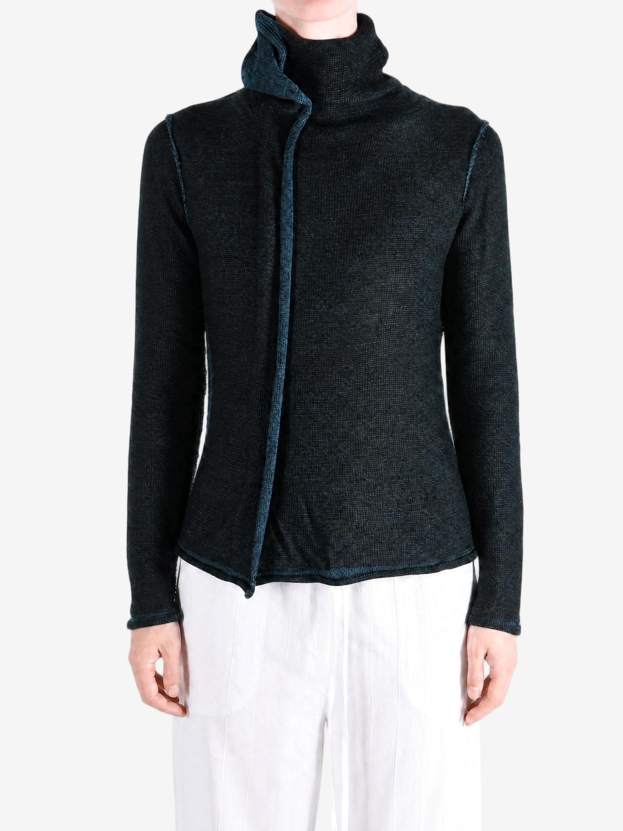 Black top worn by a person, showing the top fit