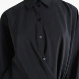 Close up of the black dress, showing texture of the silk and nylon fabric