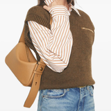 Brown bags worn by a person, showing the bags fit