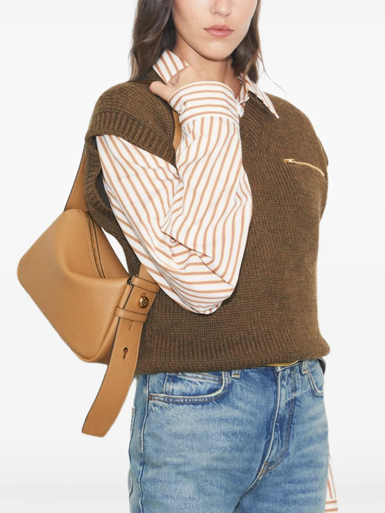 Brown bags worn by a person, showing the bags fit
