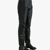Black pants worn by a person, showing the pants' fit