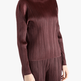 Burgundy shirt worn by a person, showing the shirt fit