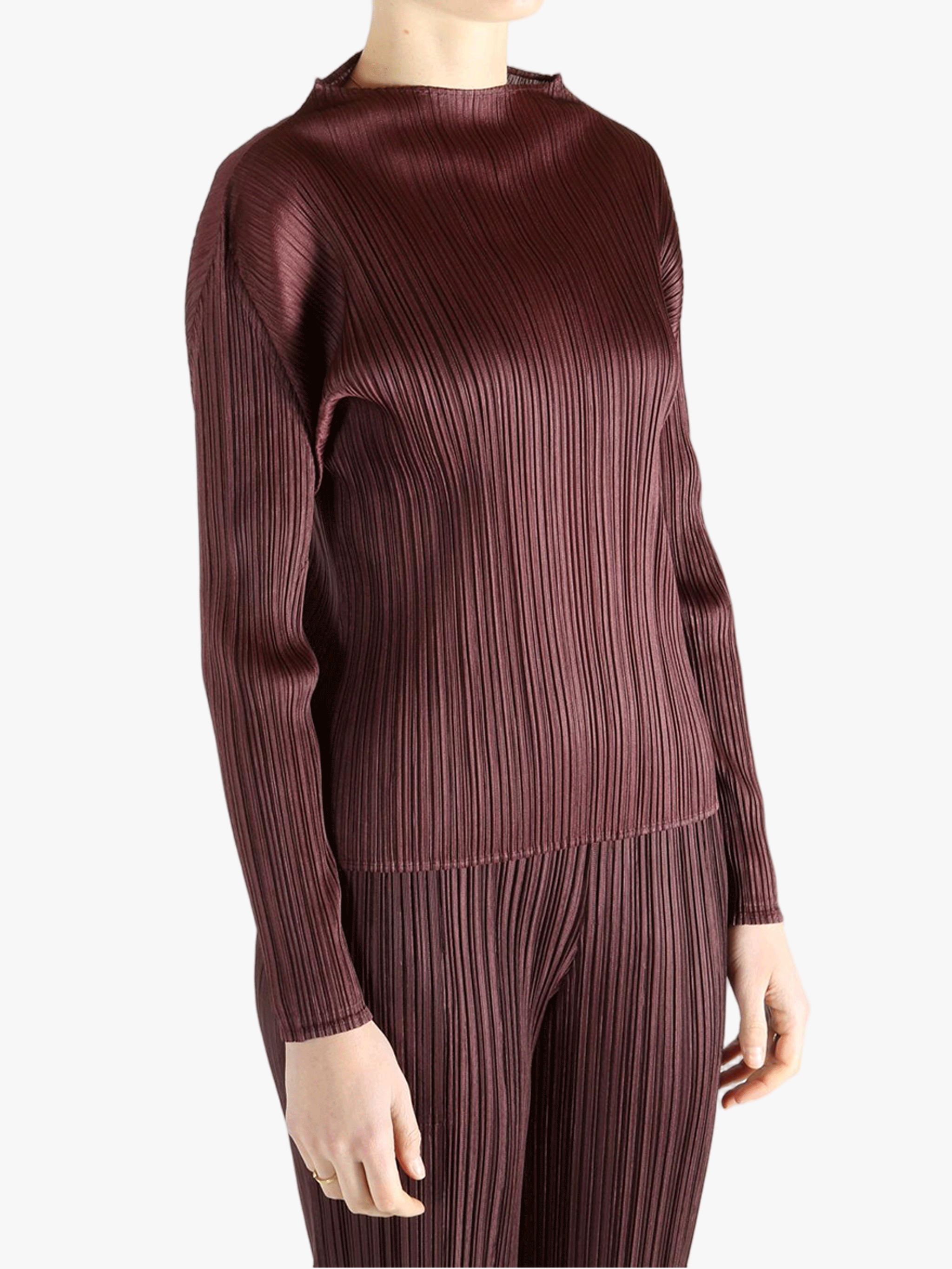 Burgundy shirt worn by a person, showing the shirt fit