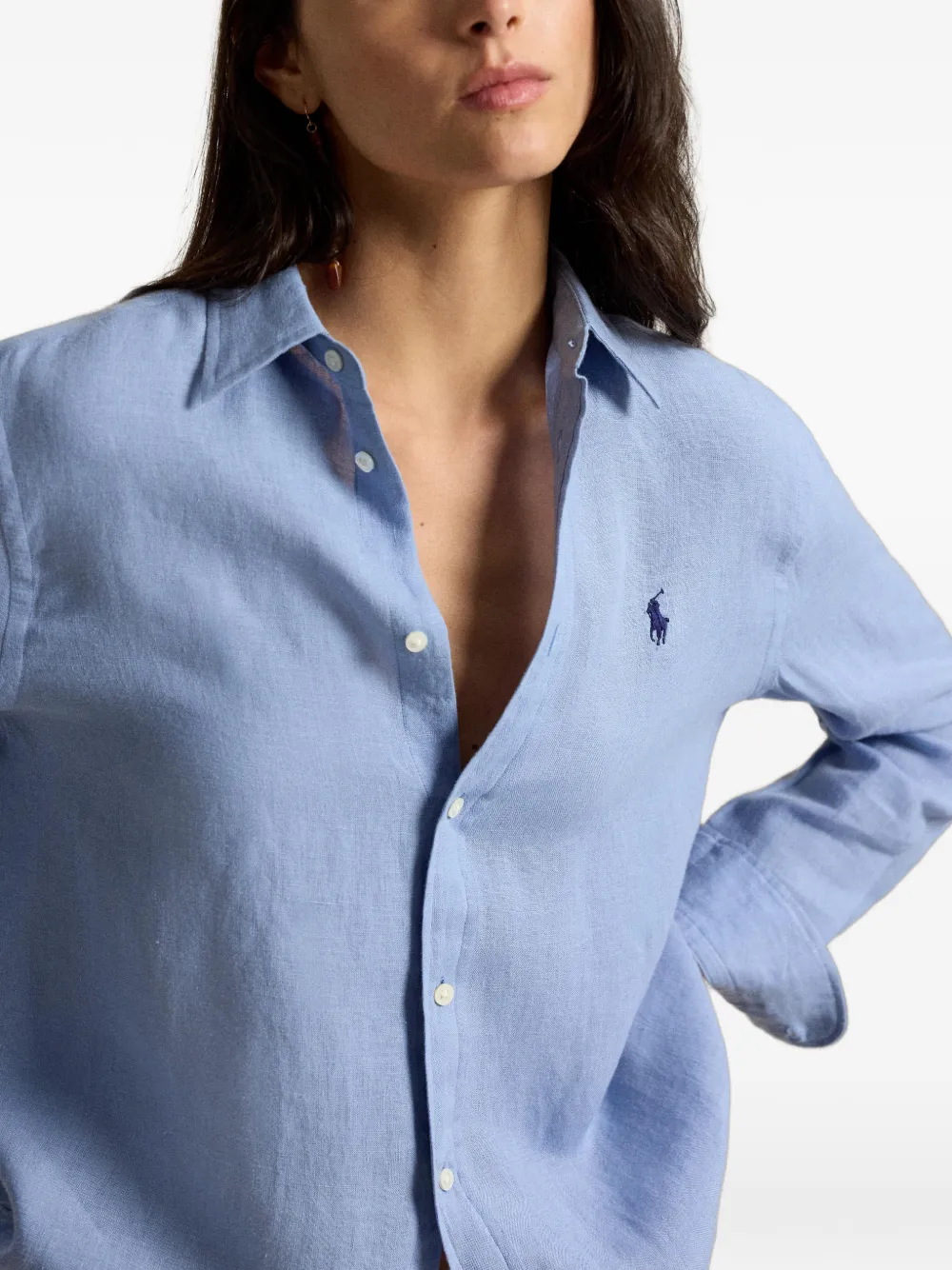 Blue shirt worn by a person, showing the shirt fit