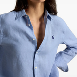 Blue shirt worn by a person, showing the shirt fit