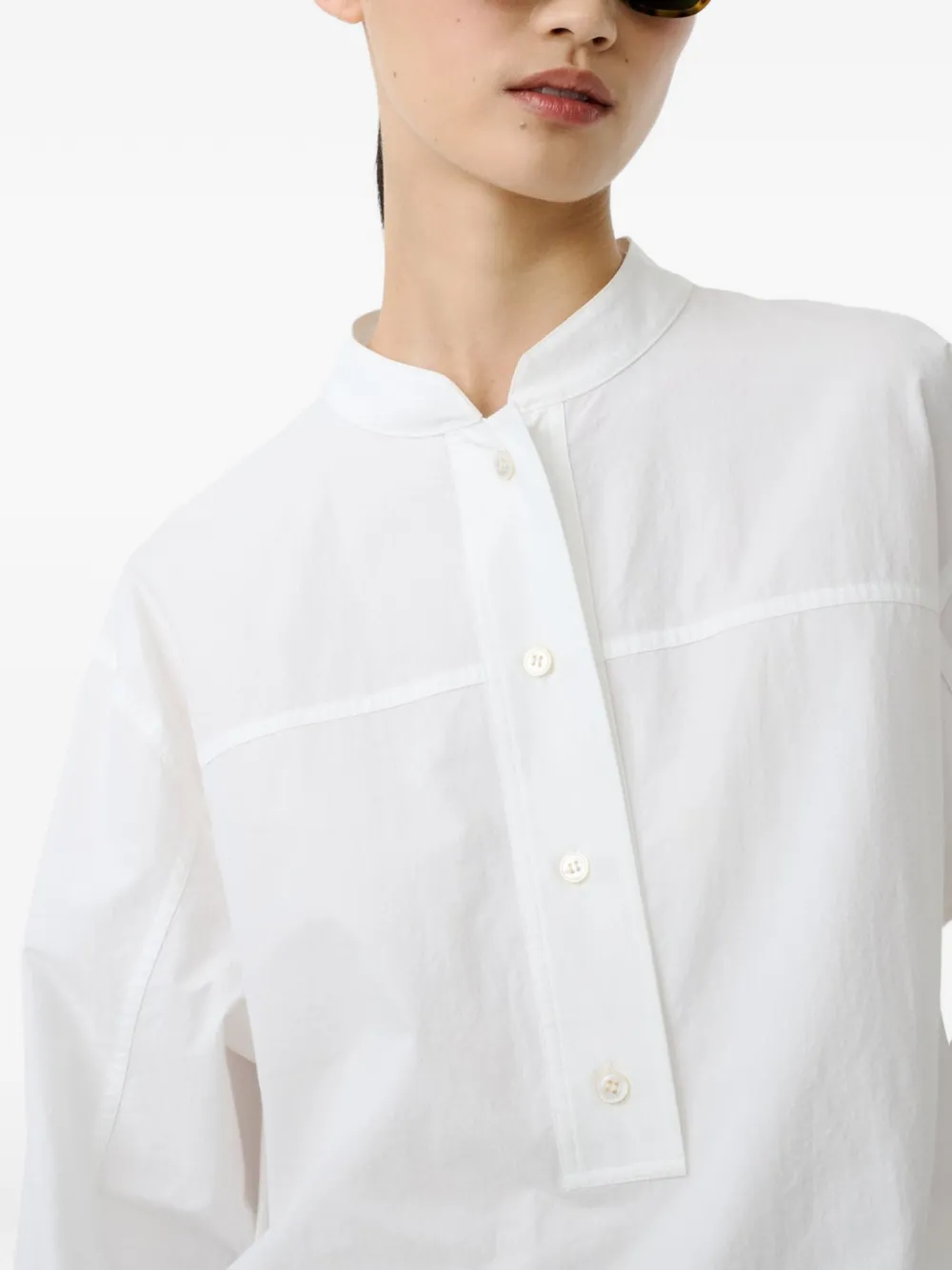 White shirt worn by a person, showing the shirt's fit