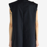 Navy dress worn by a person, showing the dress' fit