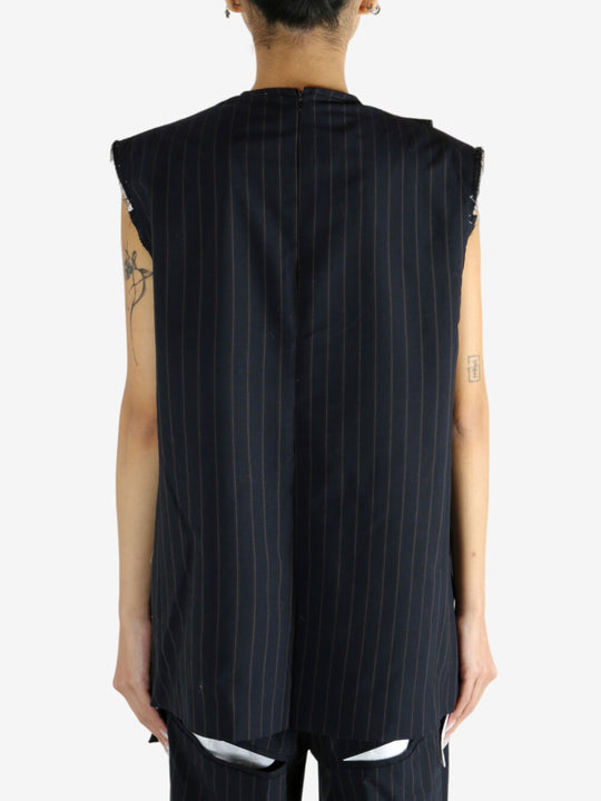 Navy dress worn by a person, showing the dress' fit