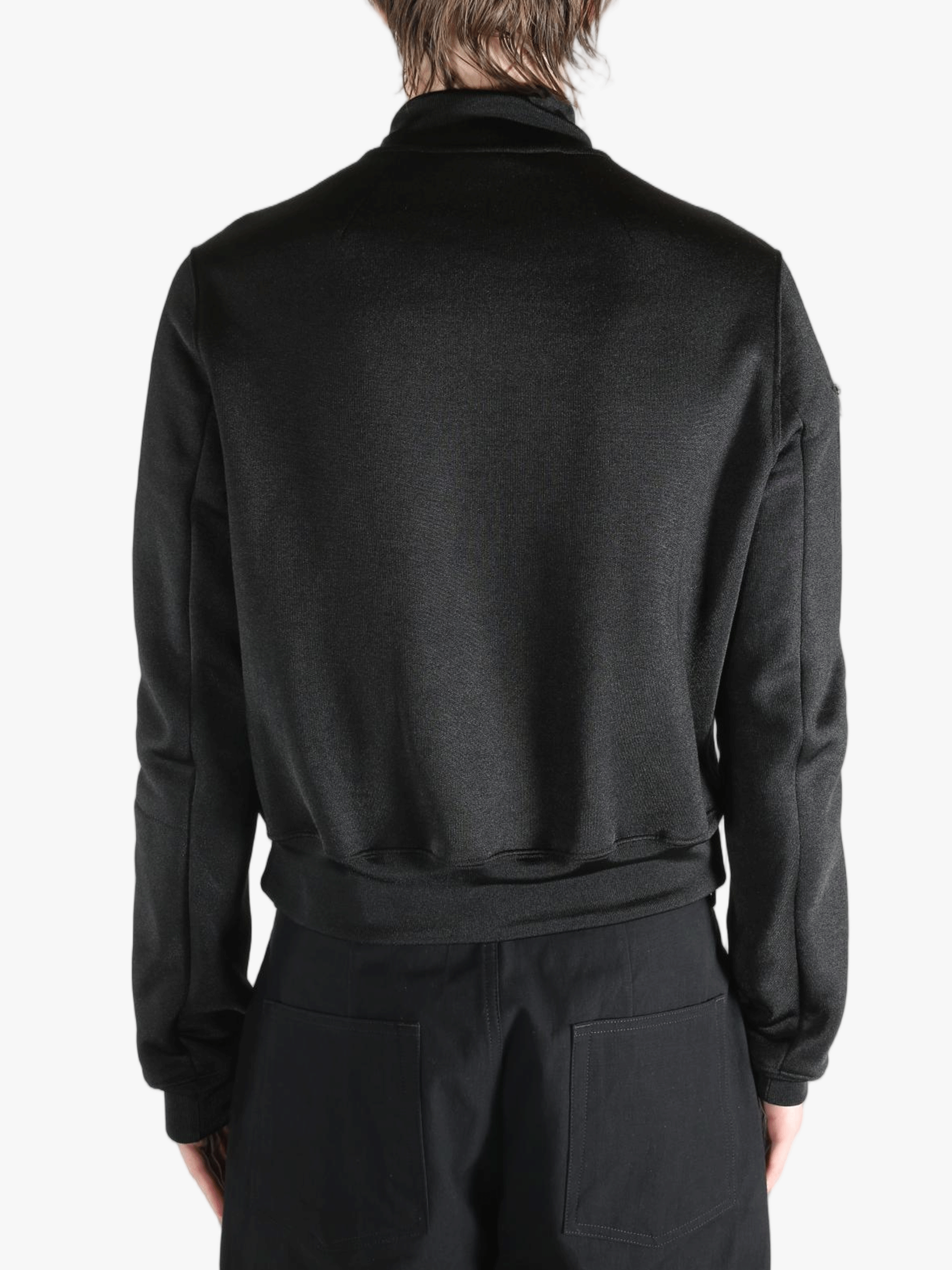 Black jackets worn by a person, showing the jackets fit