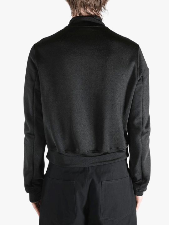 Black jackets worn by a person, showing the jackets fit