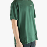 Green t-shirt worn by a person, showing the t-shirt fit