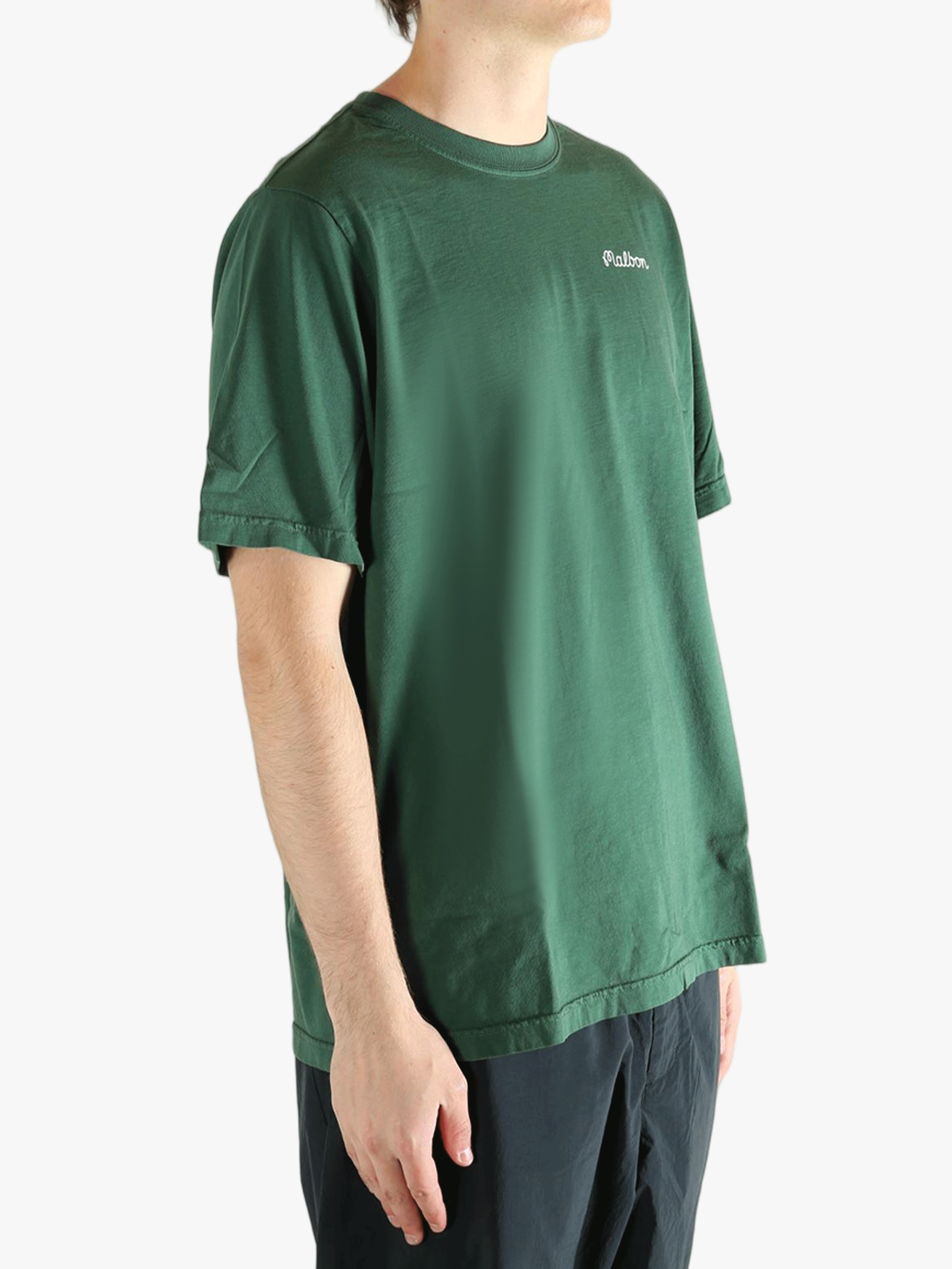 Green t-shirt worn by a person, showing the t-shirt fit