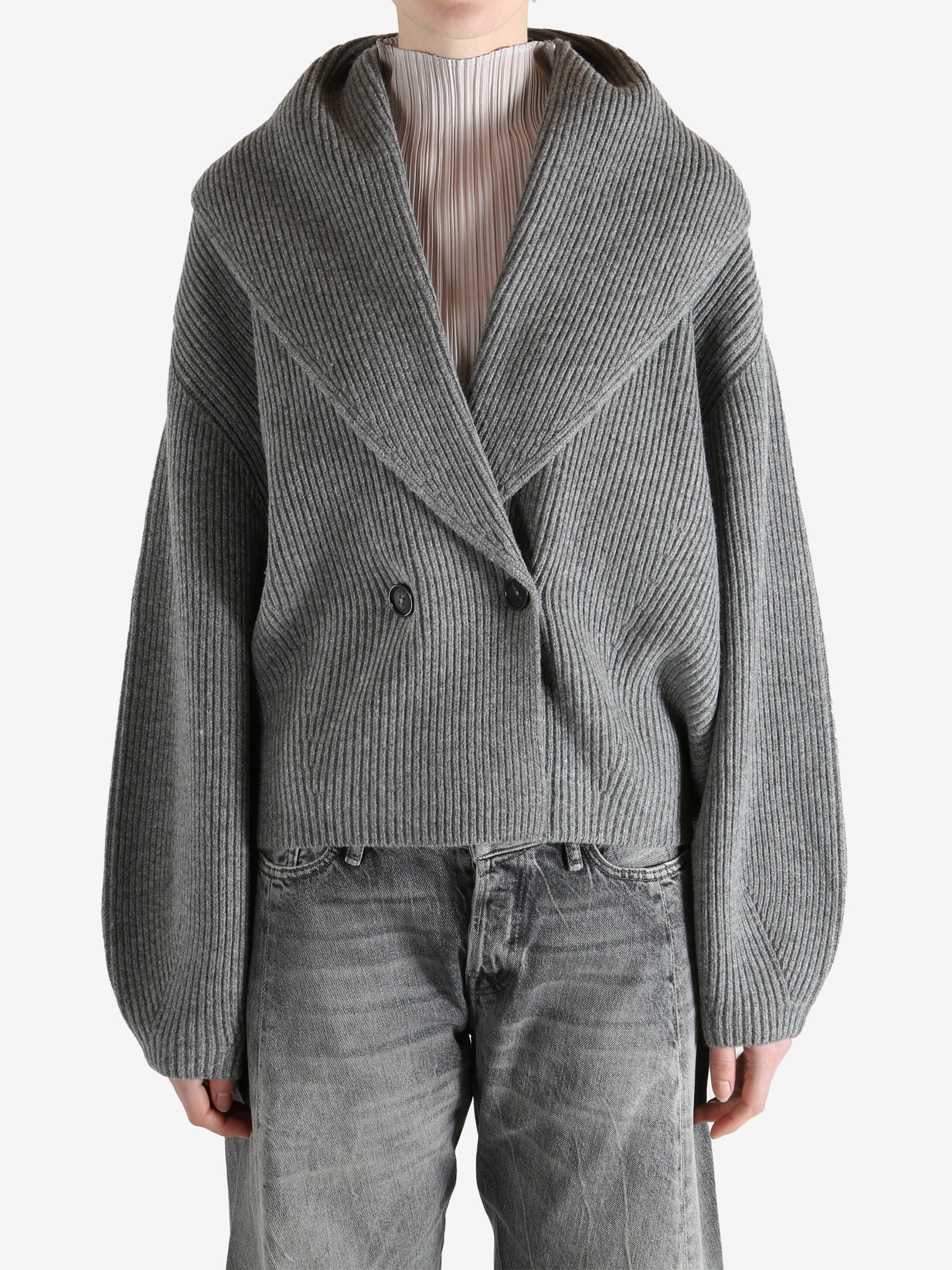  gray sweater  worn by a person, showing the sweater fit