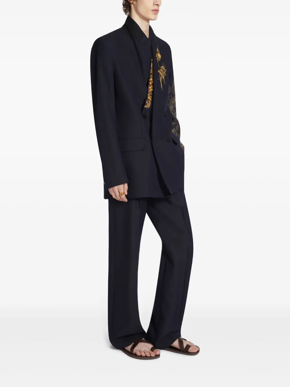 Navy jacket worn by a person, showing the  jacket's fit