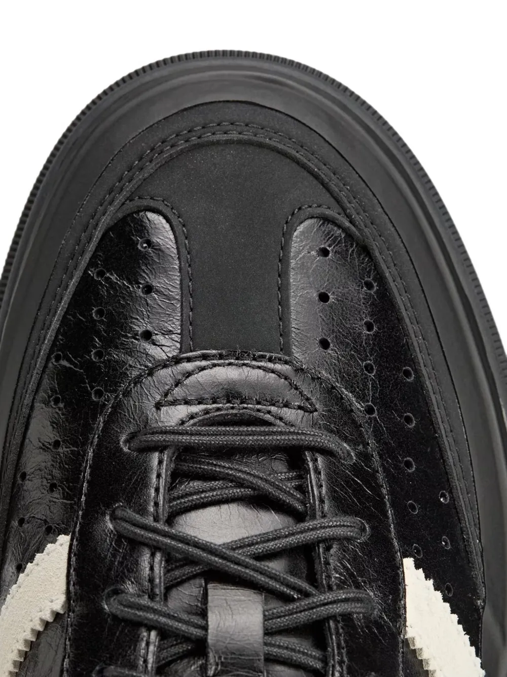 Close up of Black sneakers, showing texture of the Calf Leather fabric
