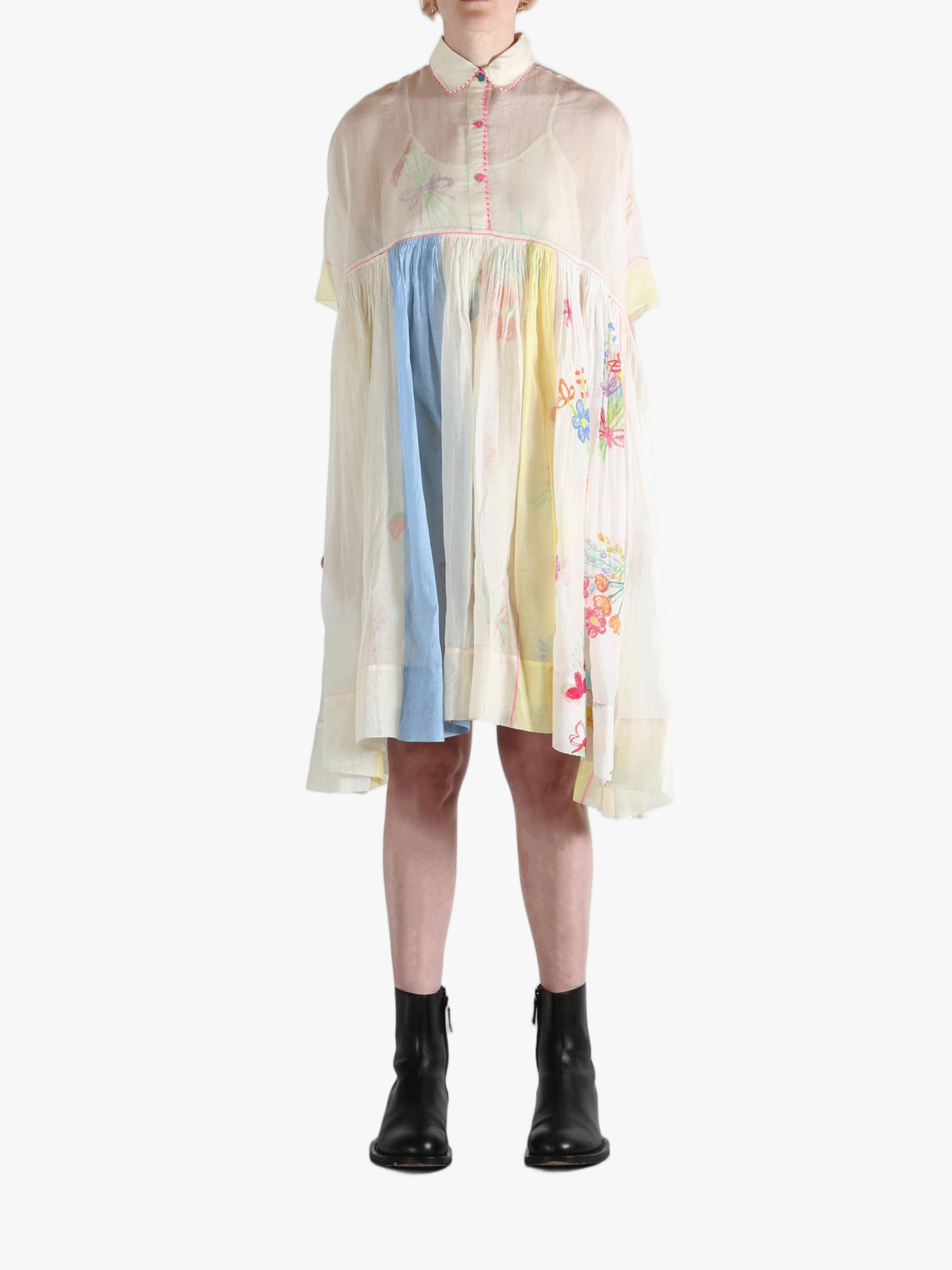 White dress worn by a person, showing the dress' fit