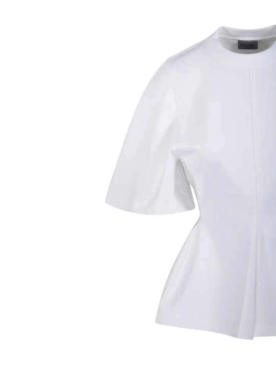 Close up of white t-shirt, showing texture of the cotton fabric