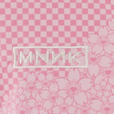Close up of Pink t-shirt, showing texture of the 100% polyester fabric