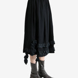 Black skirt worn by a person, showing the skirt's fit