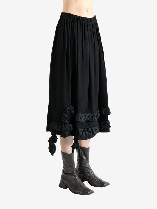 Black skirt worn by a person, showing the skirt's fit