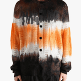 Orange cardigan worn by a person, showing the cardigan's fit