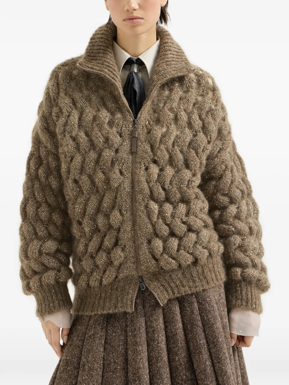 Brown knitwear worn by a person, showing the knitwear fit